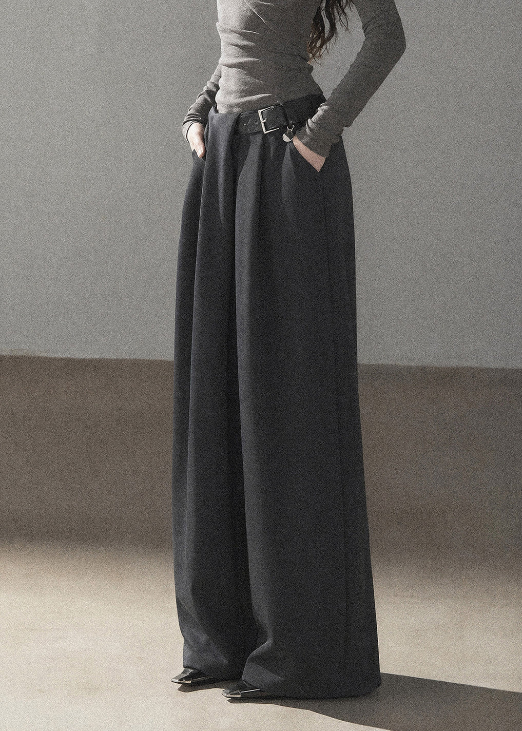 Model wearing taupe loose wide-leg pants