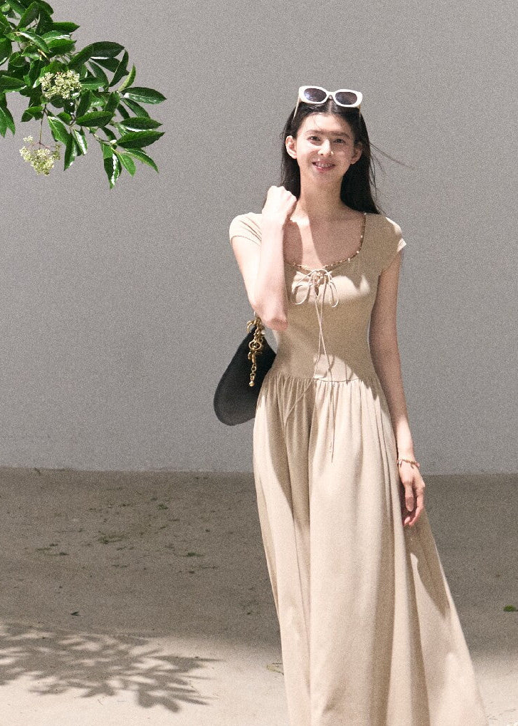 Elegant beige dress with soft waist definition