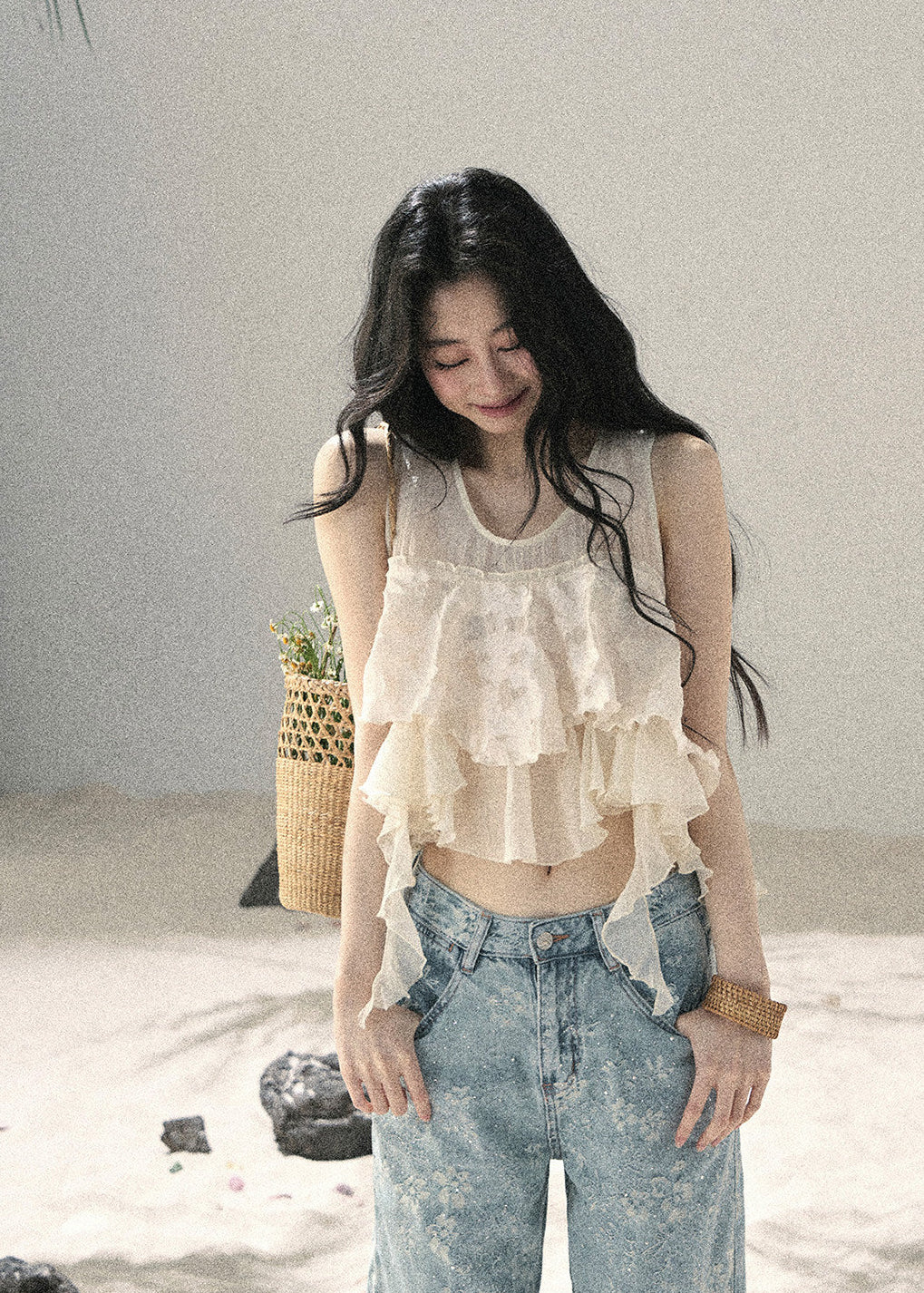 Romantic ivory sleeveless top with layered asymmetric ruffle details