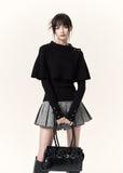Black asymmetric cape layered knit top with button-detail neckline