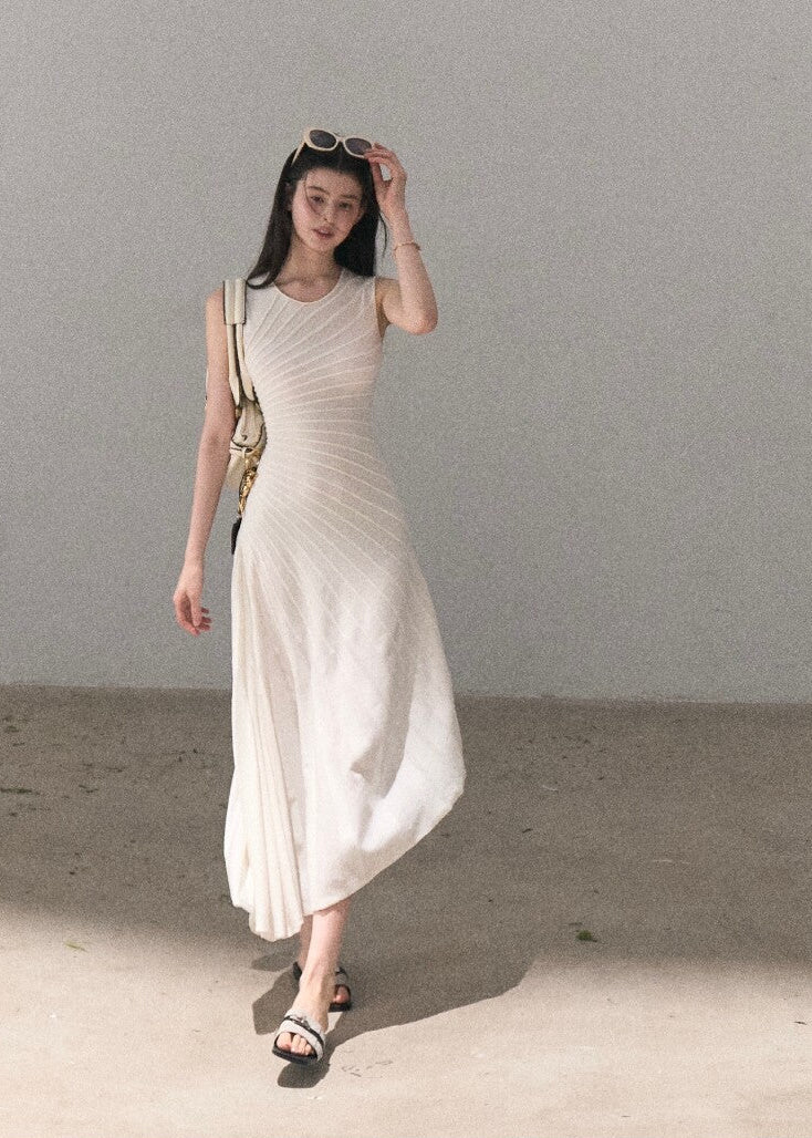 Sleeveless knit dress with diagonal pleated detail