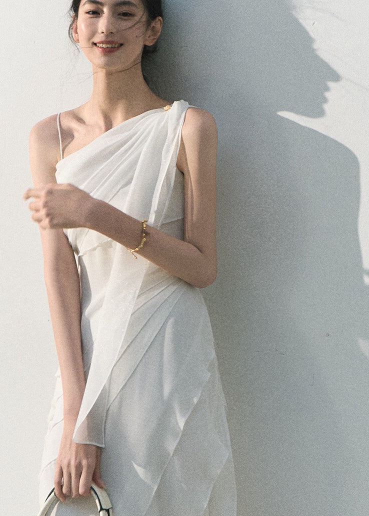 Flowing white summer maxi dress with ruffle layers