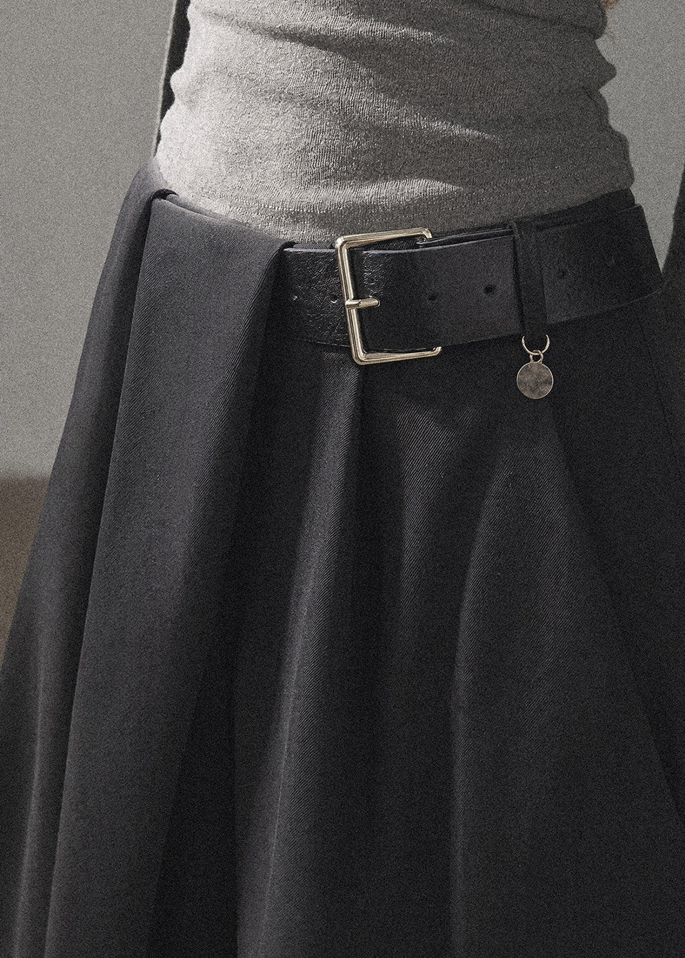 Model wearing taupe loose wide-leg pants