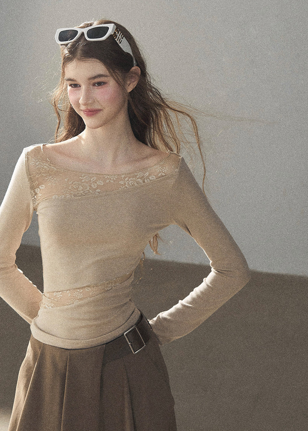 Soft ivory lace top with delicate sheer texture