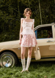 Satin ribbon camisole with textured floral mini skirt