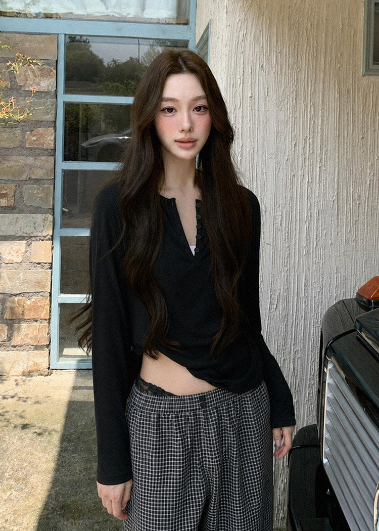 Relaxed black wool-blend Henley shirt styled with plaid pants