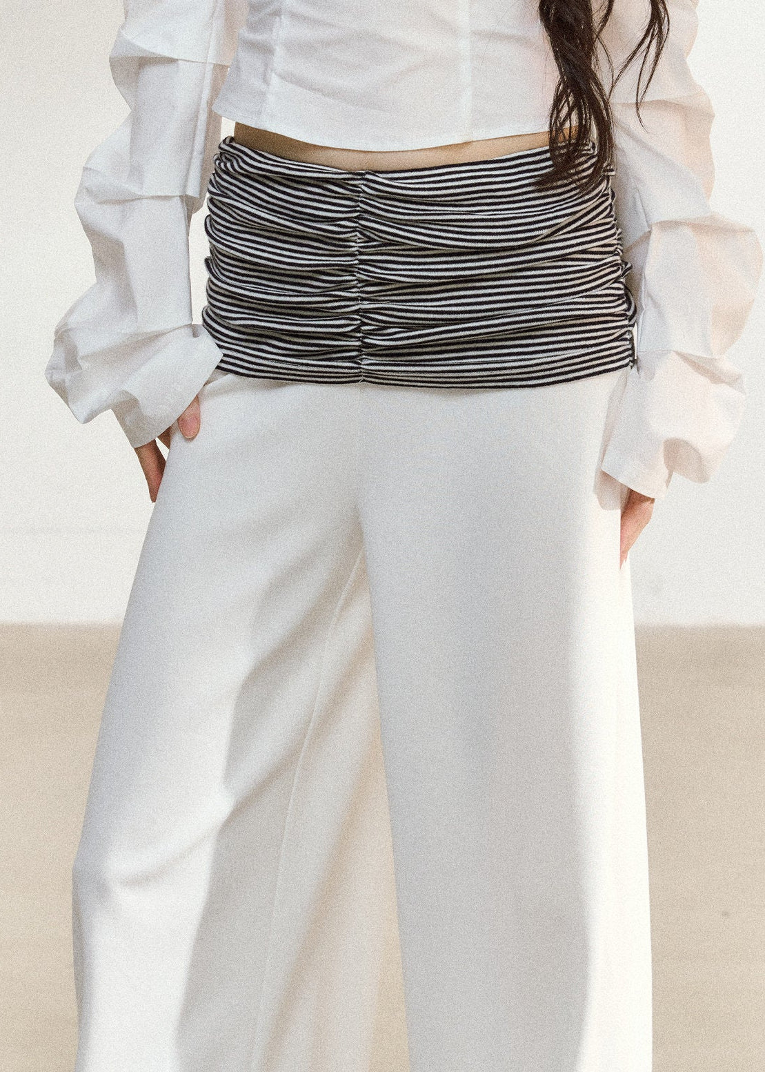 White wide-leg trousers with a ruched striped waistband