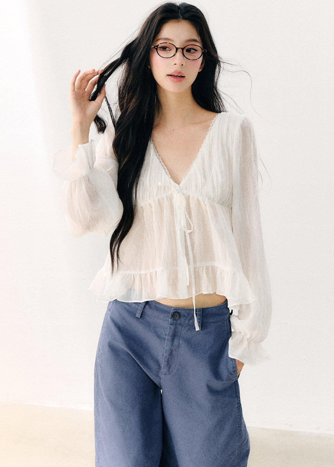 Women’s semi-sheer long-sleeve blouse with shoulder straps