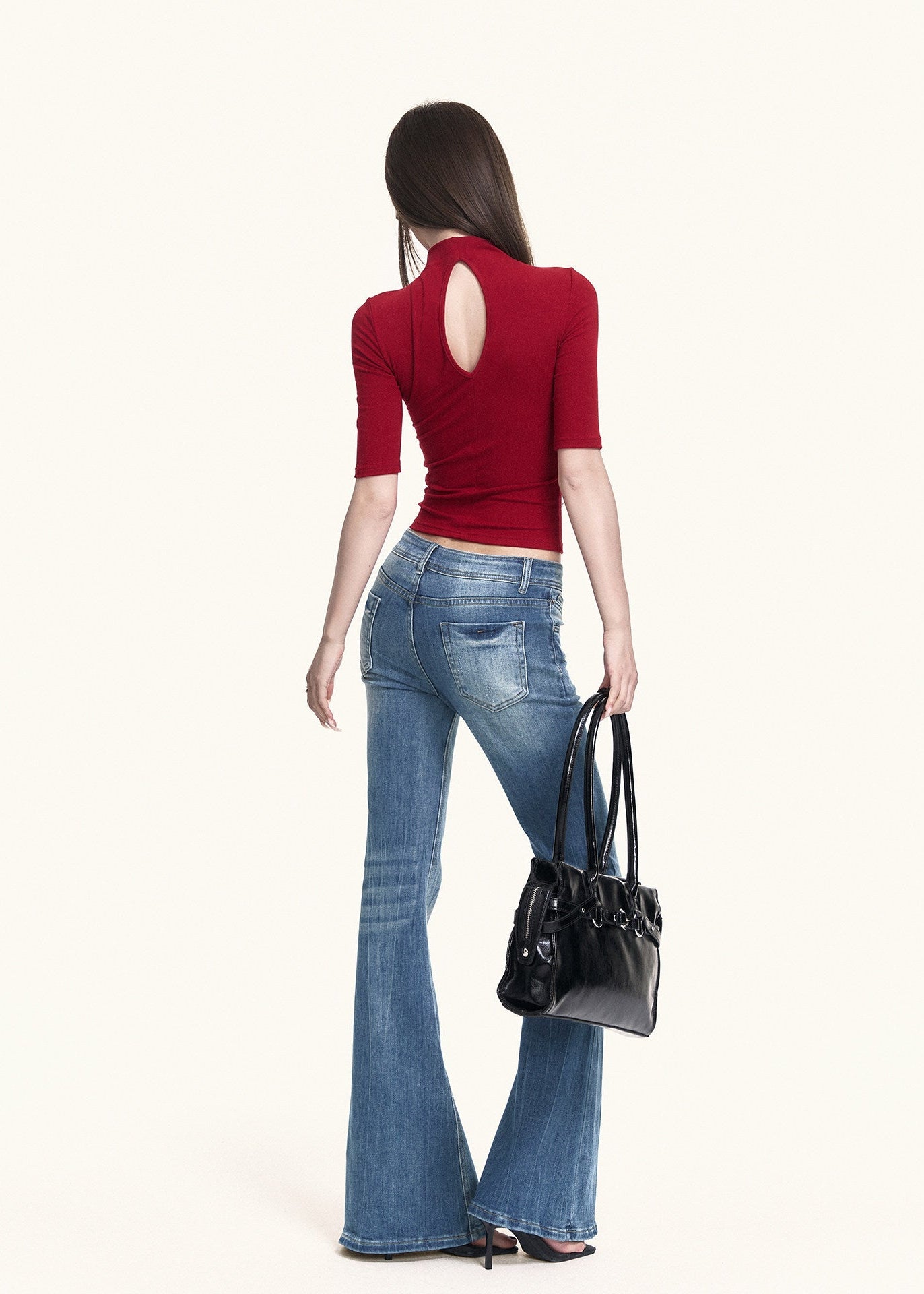 Red high-neck top with subtle back cutout