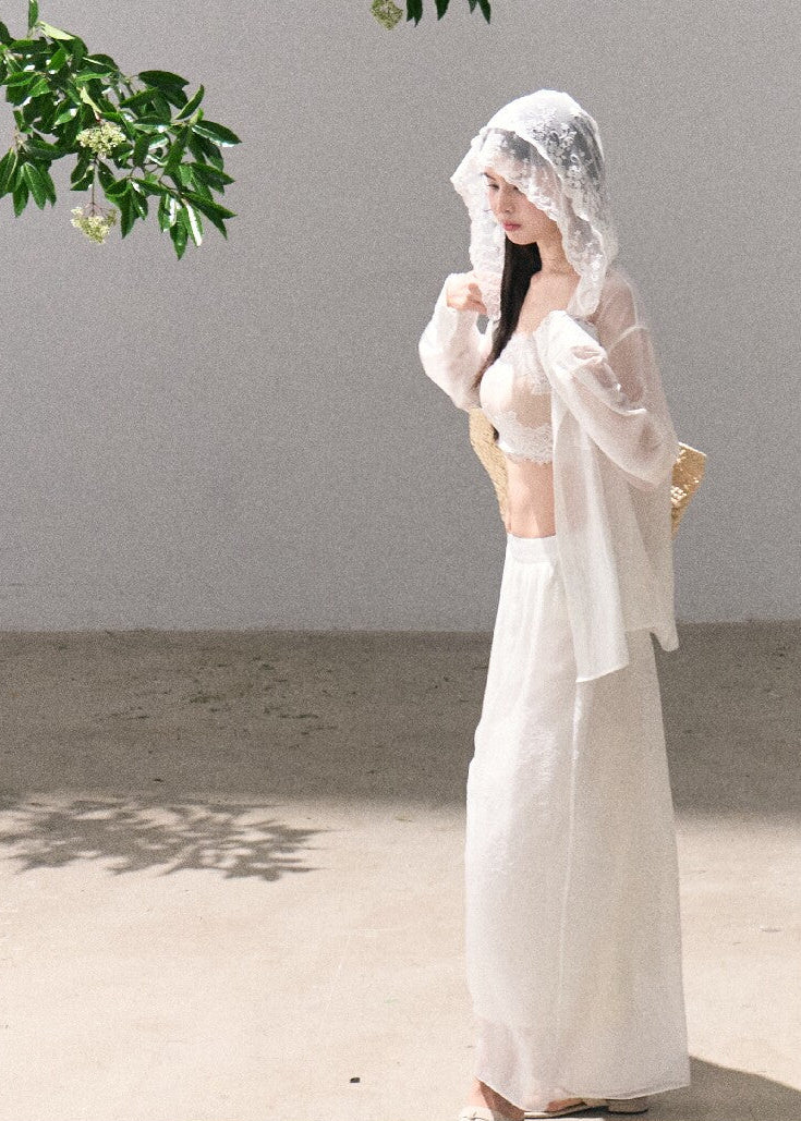 Sheer white cardigan with delicate feminine styling