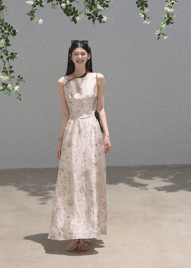 Soft pink floral dress styled with black boots