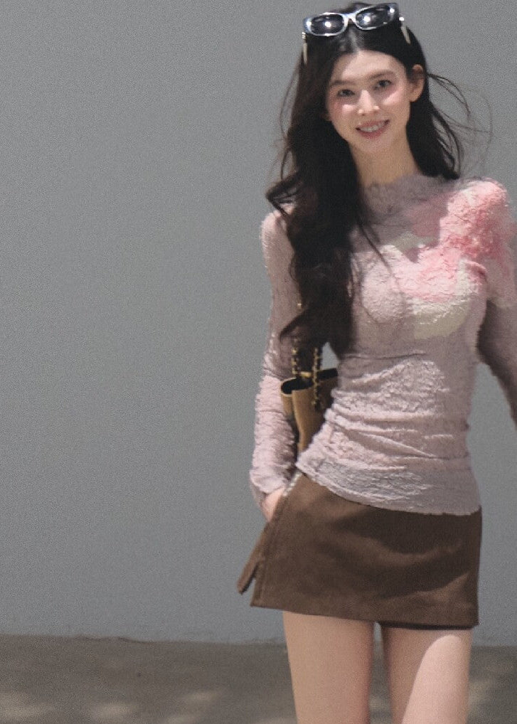Model wearing a black botanical-print long-sleeve base layer