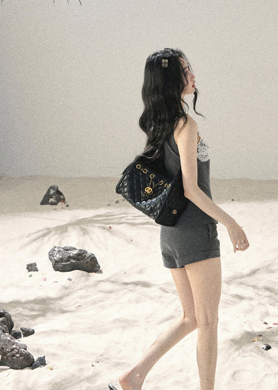 Model wearing a lace-panel top and shorts set