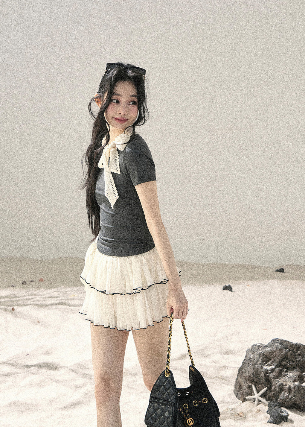 Gray fitted short-sleeve top with ivory lace bow neckline