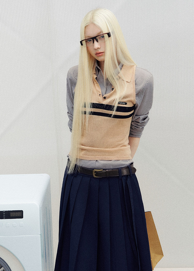 Sleeveless striped knit polo top styled with dark bottoms outdoors
