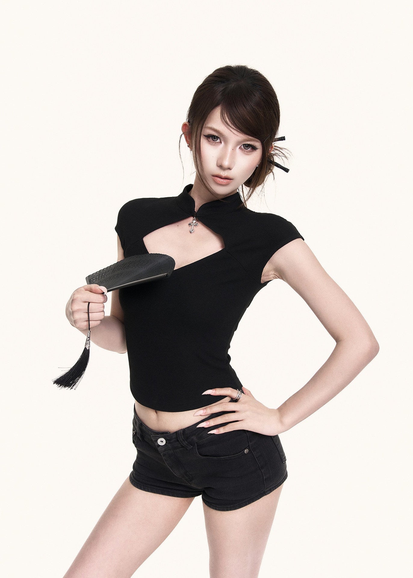 Stand-neck black top with a bold cutout detail