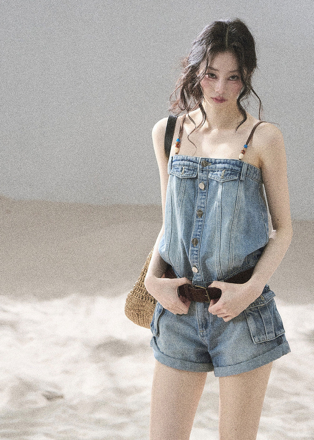 Denim romper with shorts and utility-style pockets