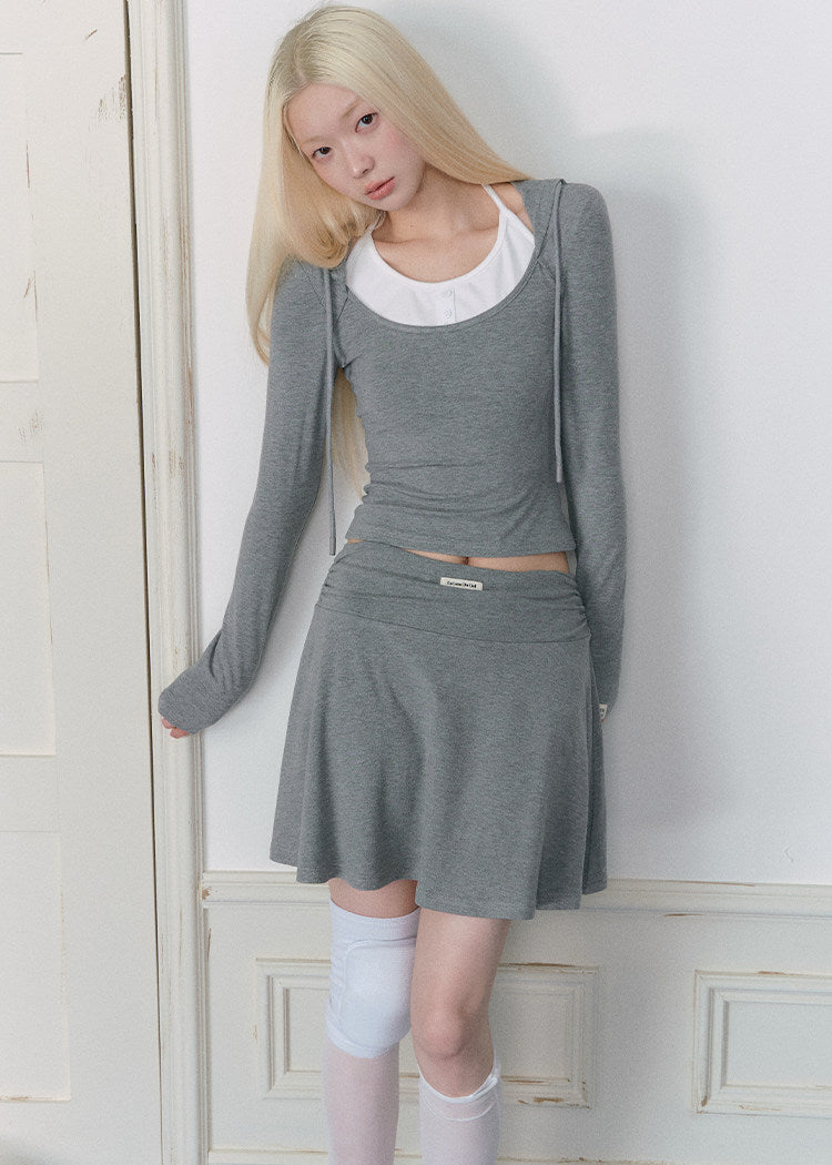 Faux two-piece long-sleeve top with contrast neckline and gray mini skirt