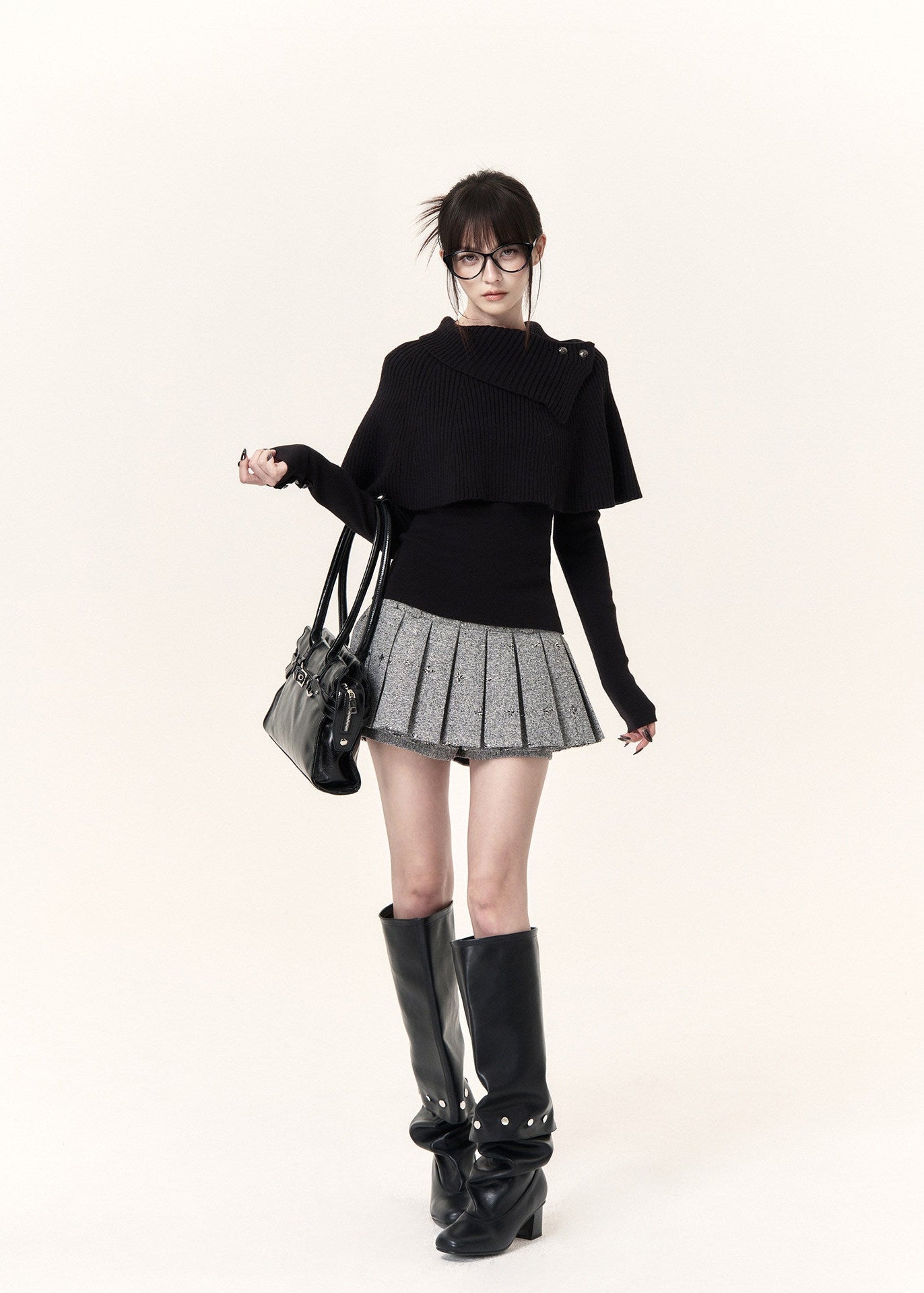 Black asymmetric cape layered knit top with button-detail neckline