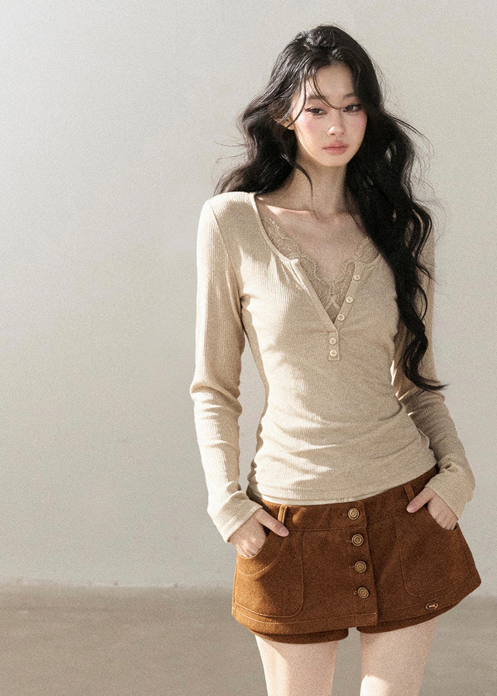 Romantic faux layered V-neck top with decorative front buttons