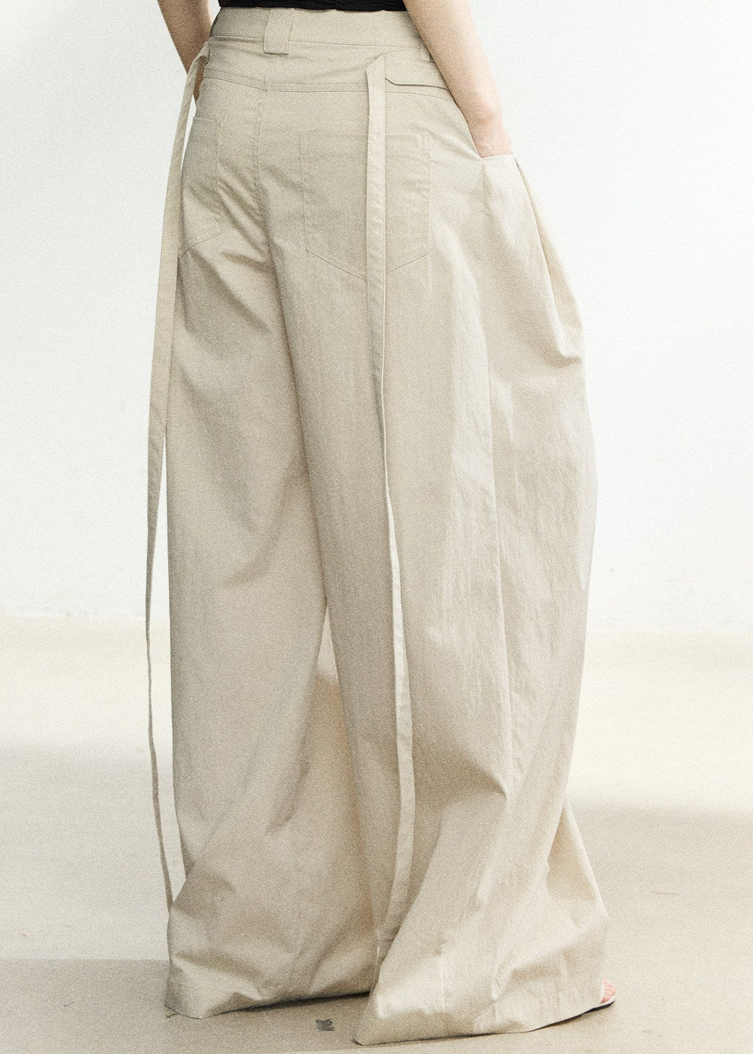 Soft beige full-length pants with a tailored waistband