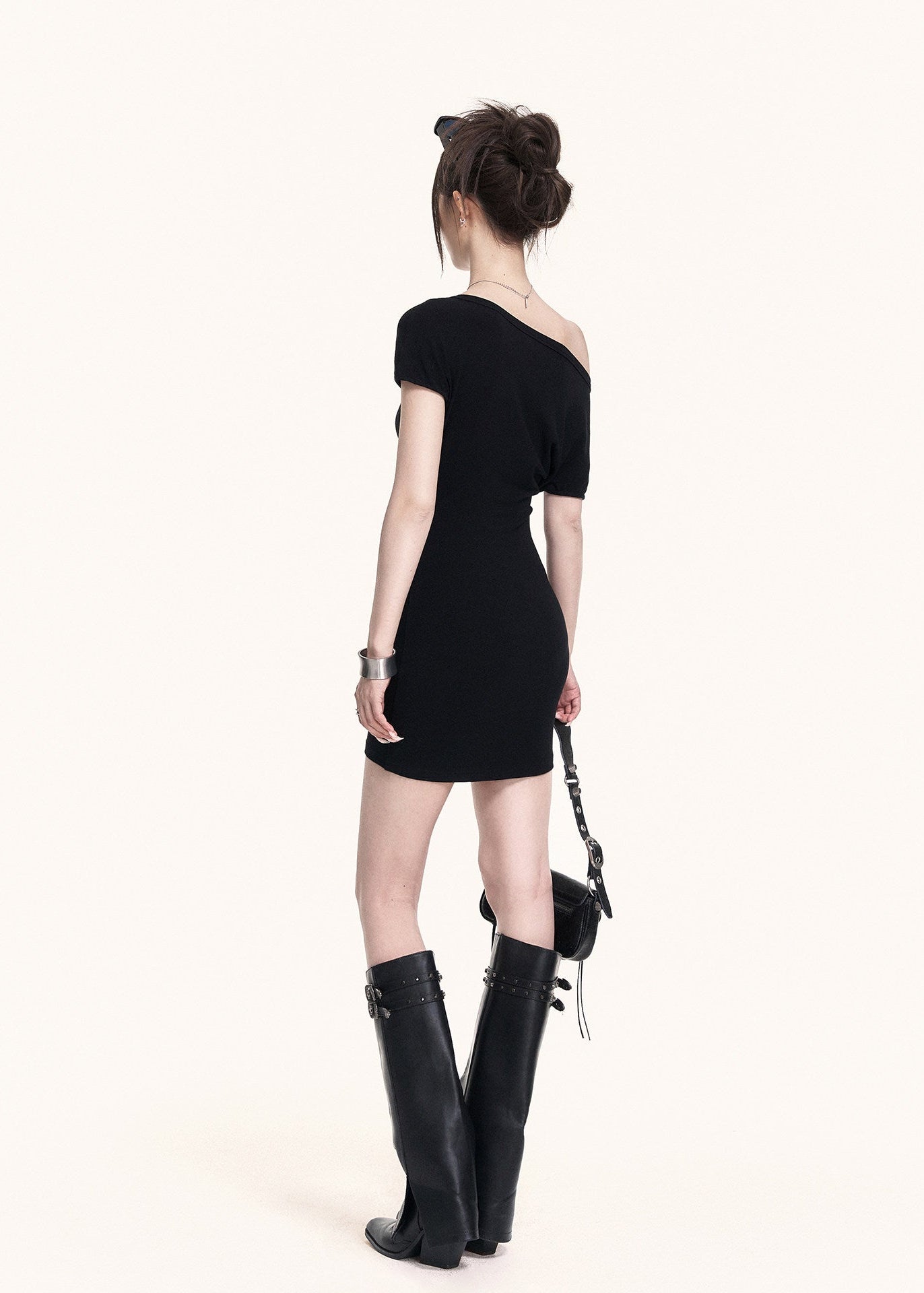 Black street-style mini dress with a subtle graphic detail