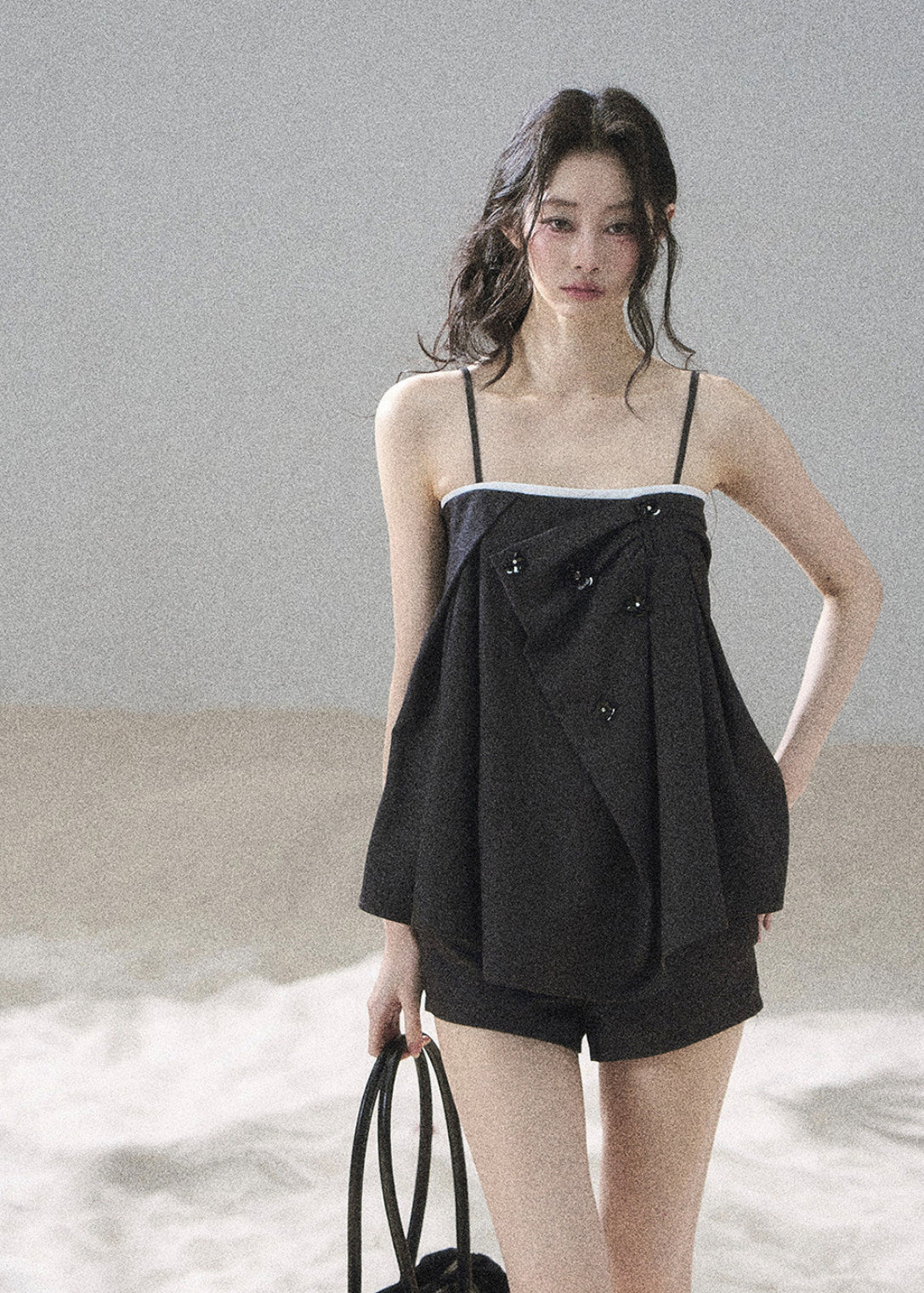 Modern black suiting set with an asymmetric layered front