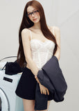 Model wearing an ivory embroidered corset camisole under a dark blazer
