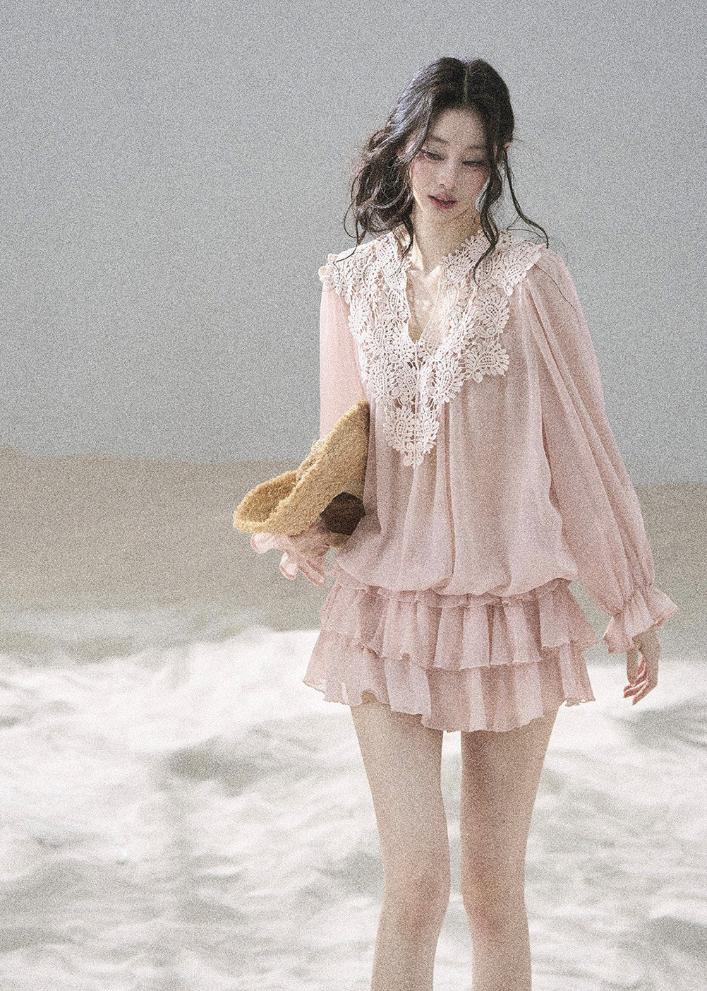 Blush balloon-sleeve blouse with a matching layered mini skirt