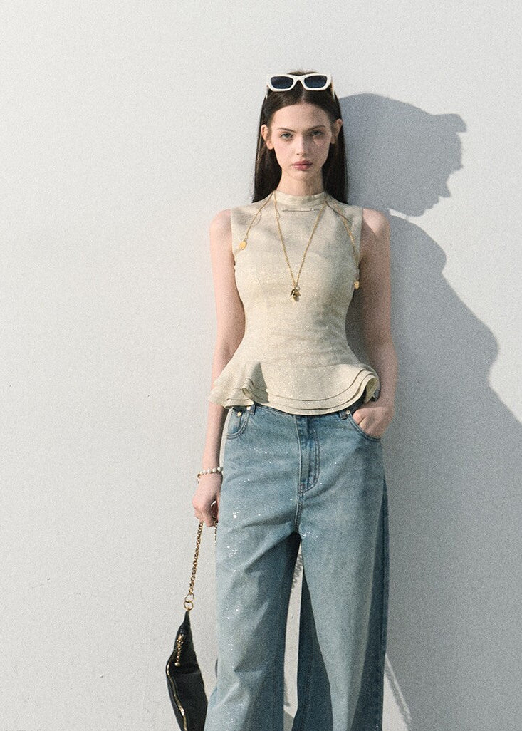 Elegant sleeveless top with a soft peplum silhouette