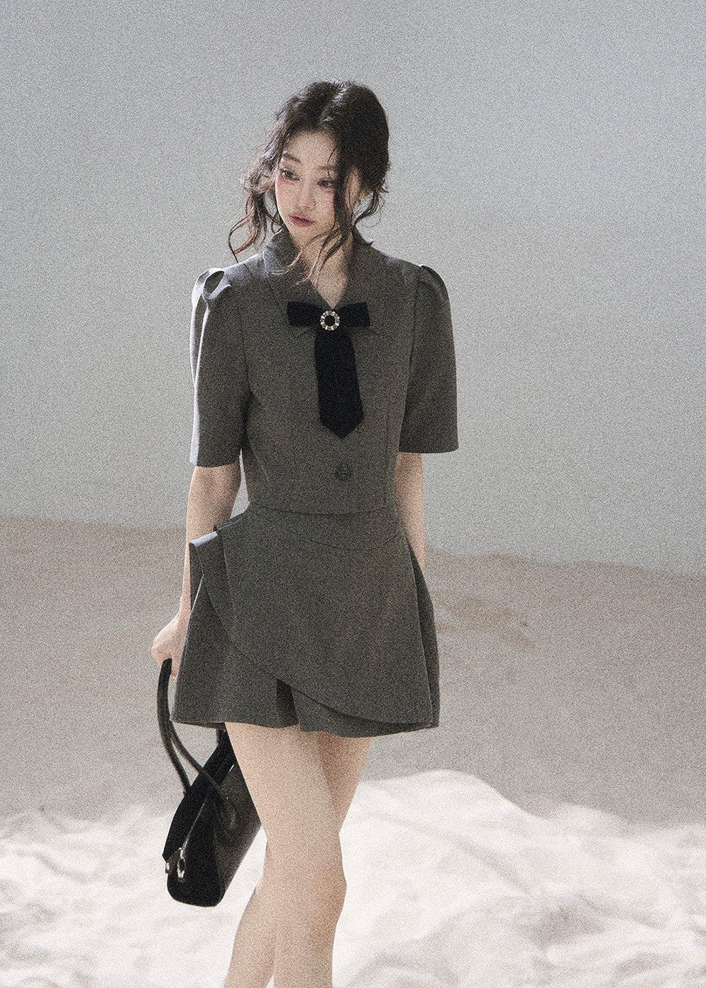 Cropped short-sleeve blazer featuring a jeweled velvet bow
