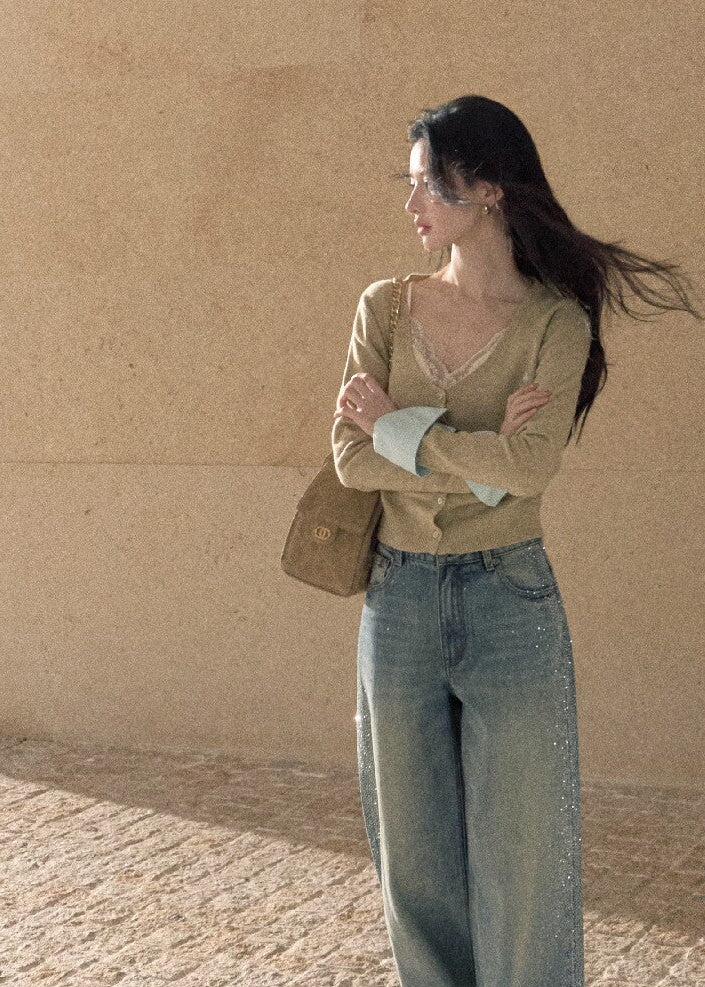 Grey fine-knit cardigan with deep neckline and pastel contrast cuffs