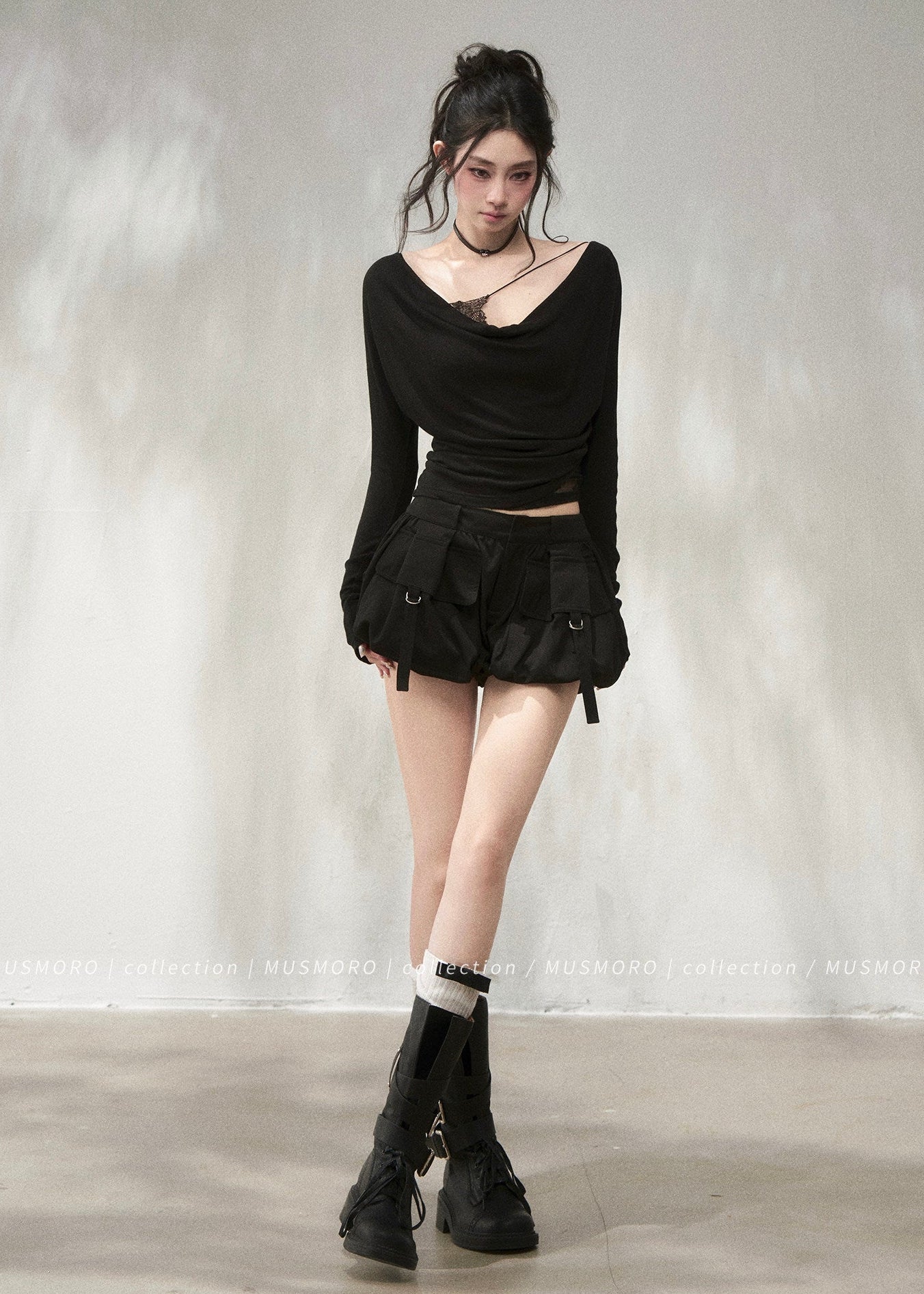 Elegant draped neck top styled with black wide-leg denim jeans