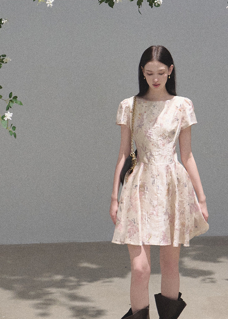Soft pink floral dress styled with black boots