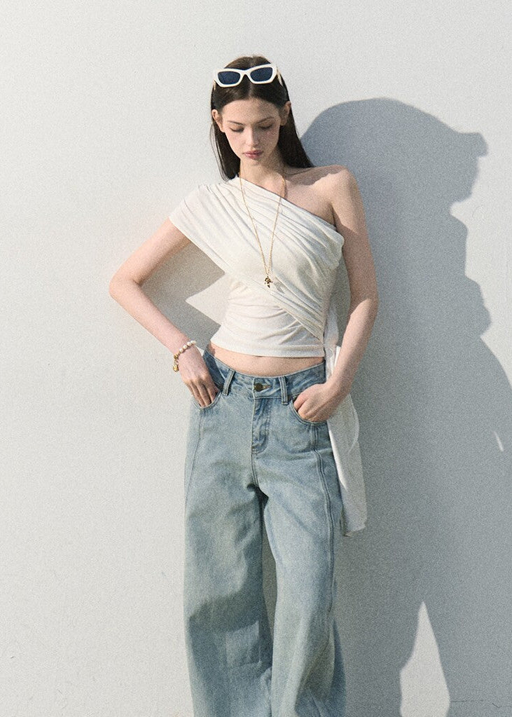 Soft asymmetrical shoulder top styled with relaxed blue jeans