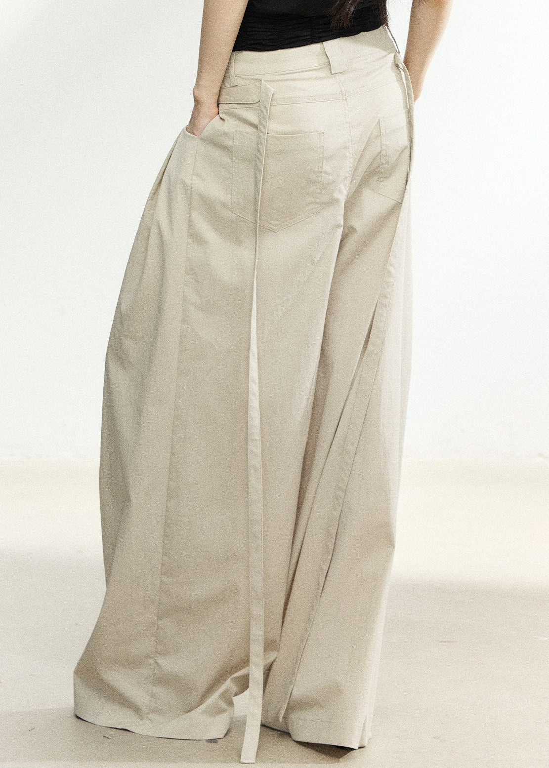 Soft beige full-length pants with a tailored waistband