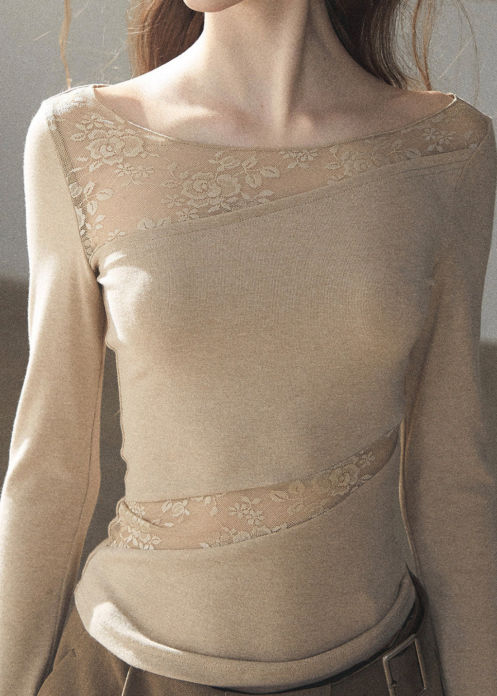 Soft ivory lace top with delicate sheer texture