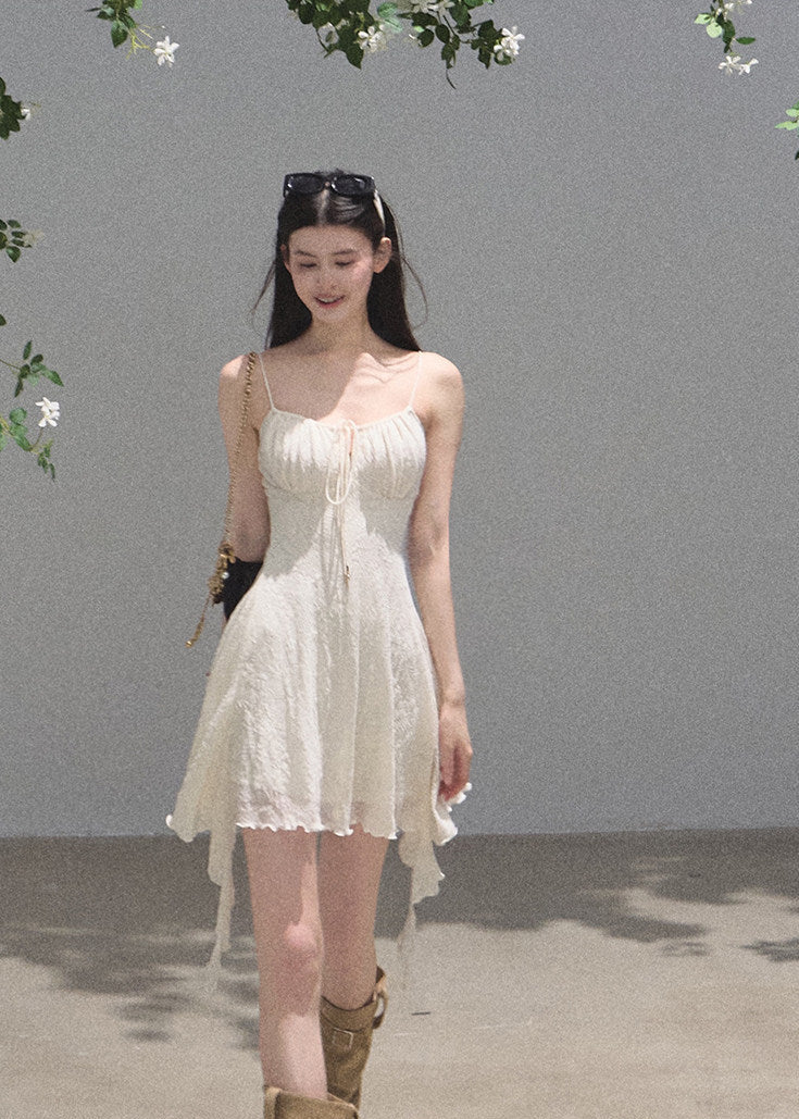Textured mini dress with fitted waist and airy draped hem