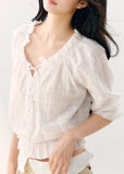 White cotton blouse with gathered wave pleats and puff sleeves