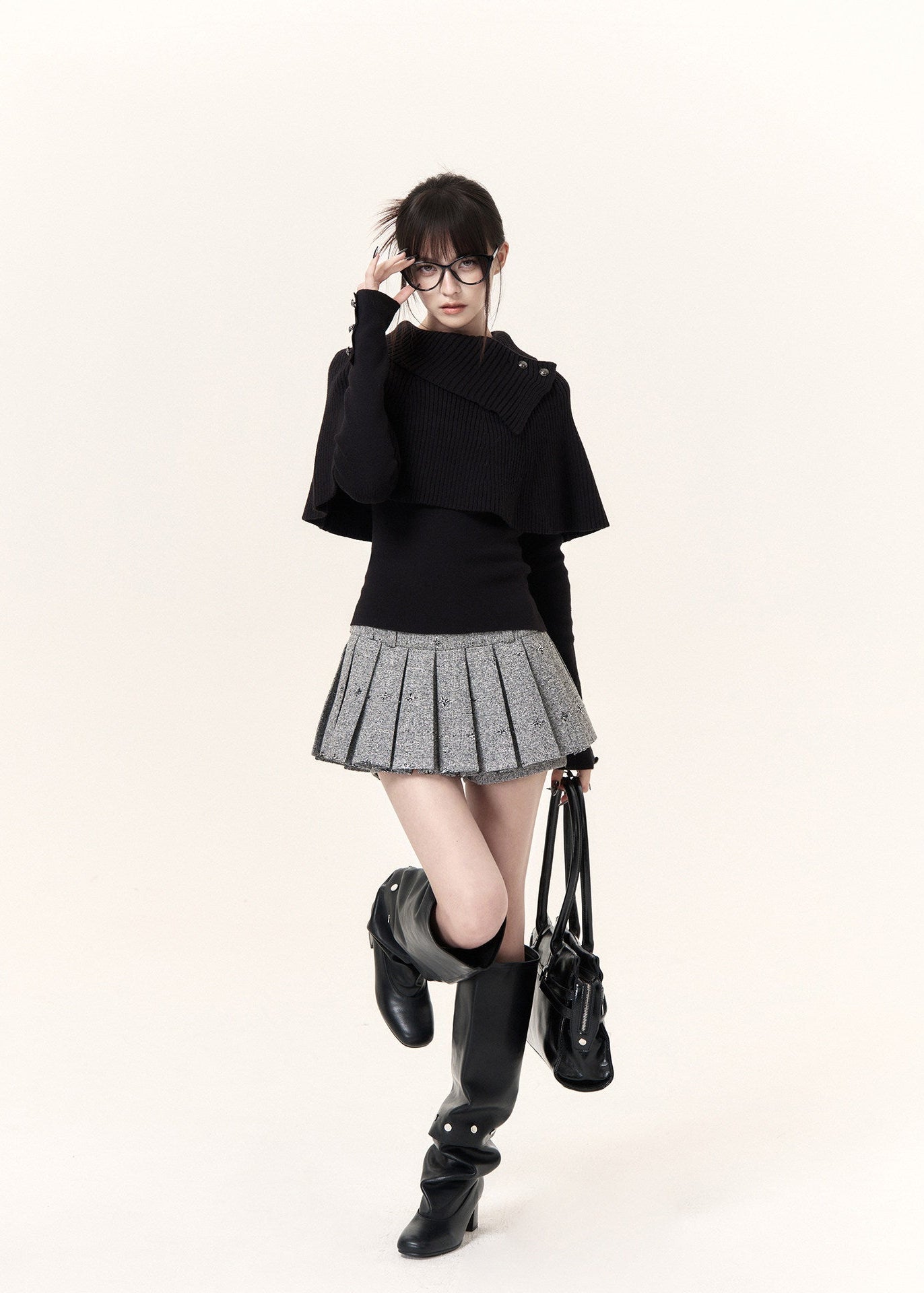 Black asymmetric cape layered knit top with button-detail neckline