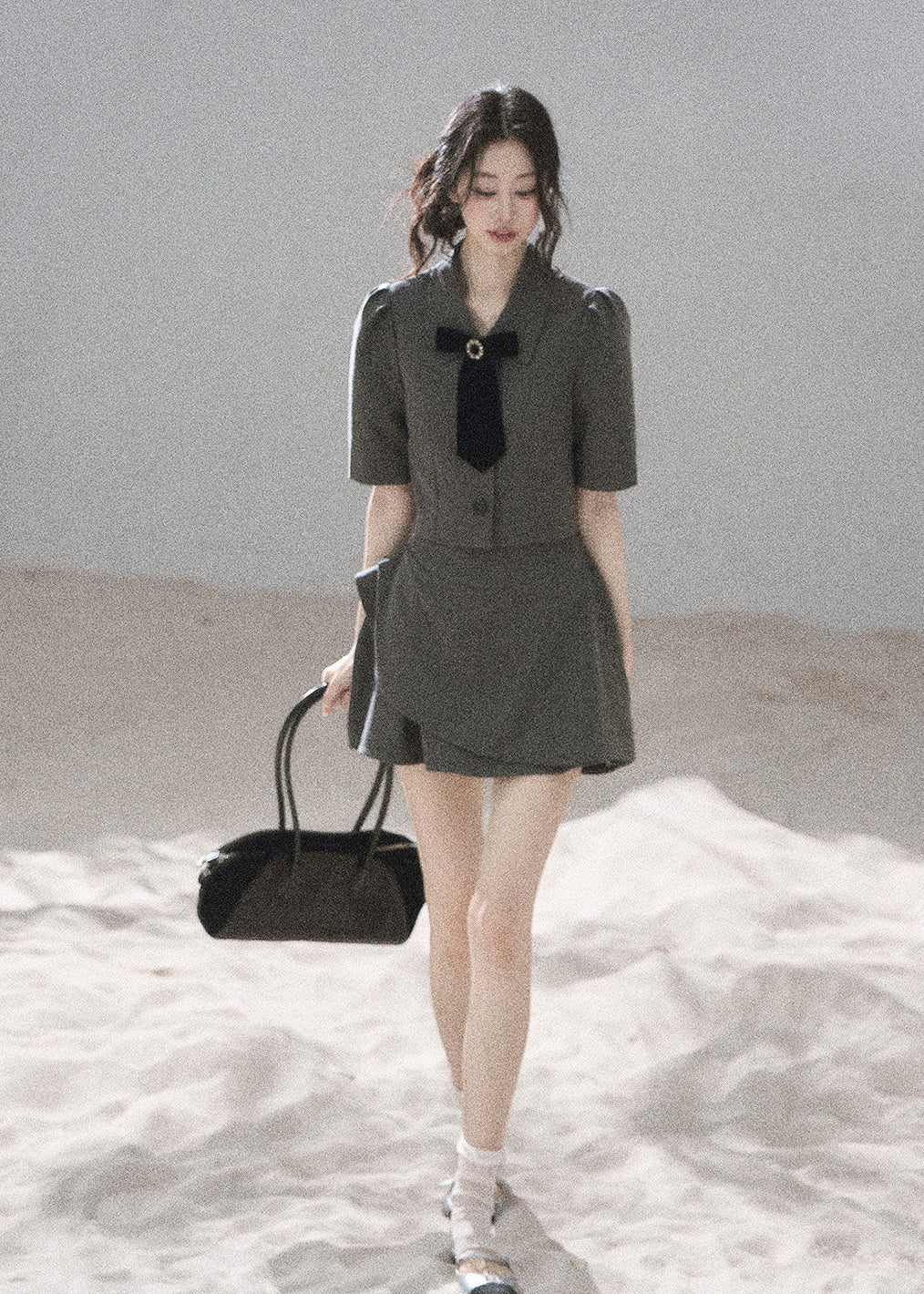 Gray tailored blazer skirt set with softly structured shoulders