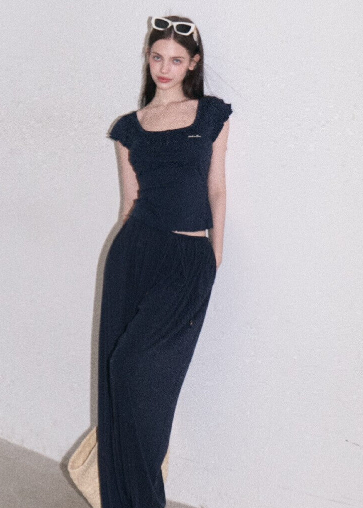 Slim navy wool-blend top styled with denim