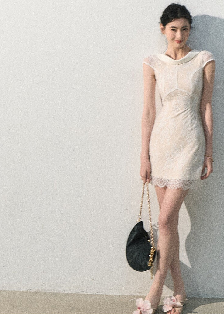 Semi-sheer ivory lace midi dress with romantic detailing