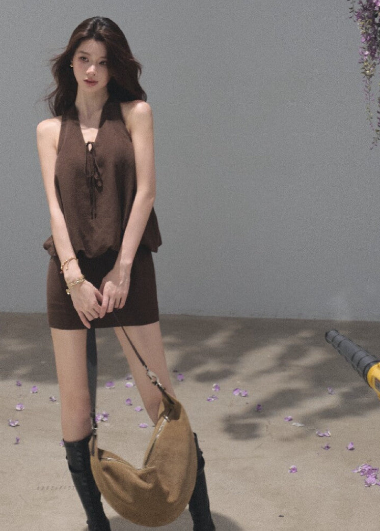 Brown sleeveless halter mini dress with a relaxed flowing silhouette