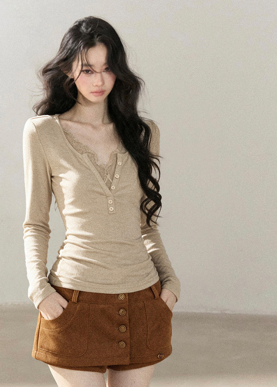 Romantic faux layered V-neck top with decorative front buttons