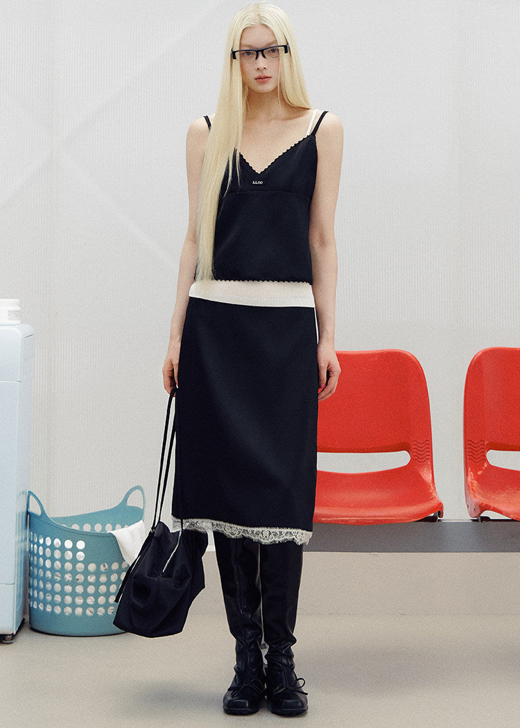 Models wearing pink and black lace-trim camisole and midi skirt sets