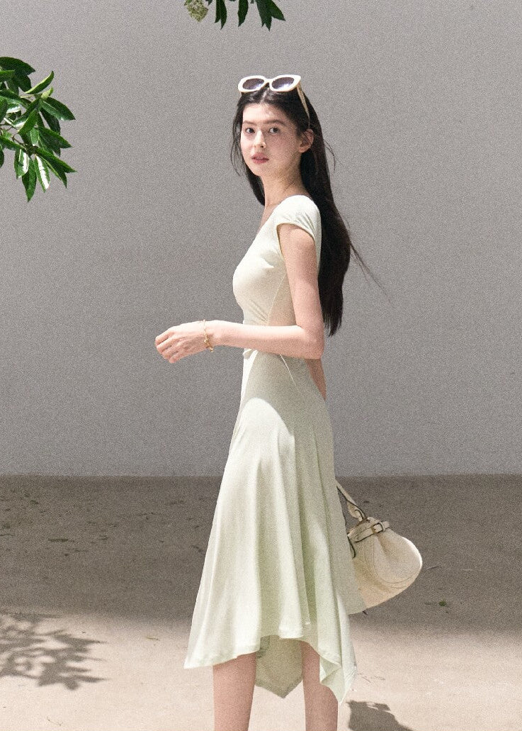Soft green sleeveless midi dress with elegant drape