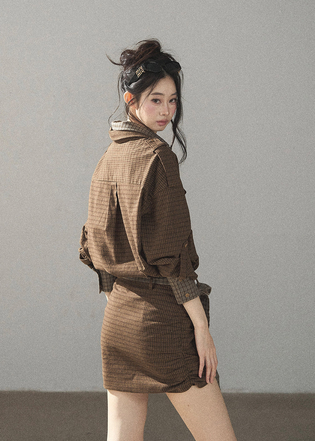 Vintage-inspired brown plaid shirt dress