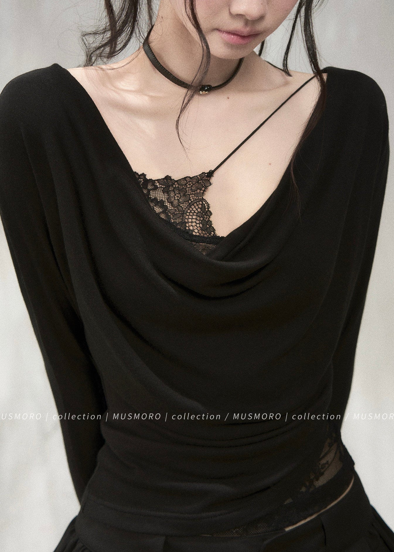 Elegant draped neck top styled with black wide-leg denim jeans