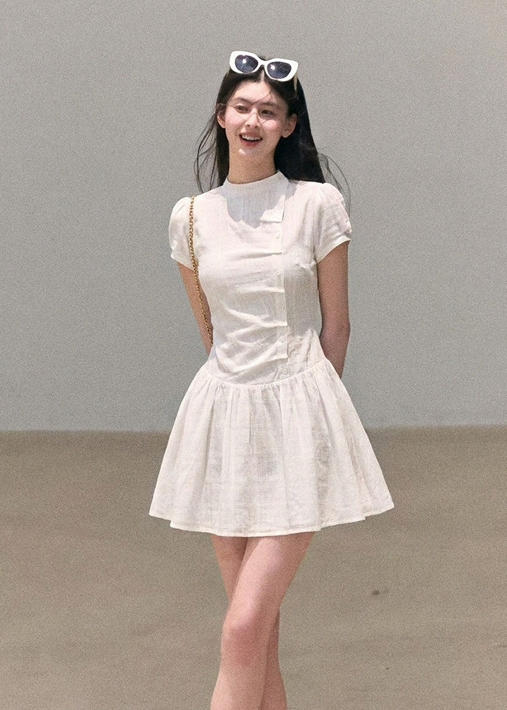 Puff-sleeve mini dress styled with boots